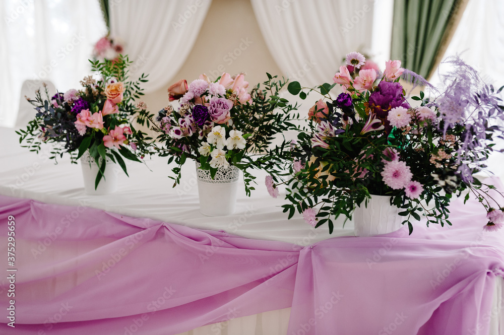 Big bouquet of fresh pink, blue, white flowers and greenery in vase. Wedding flowers, bridal bouquet closeup. Decor on table, vintage style. Decoration objects. Big bouquet of fresh pink, blue, white flowers and greenery in vase. Wedding flowers, bridal bouquet closeup. Decor on table, vintage style. Decoration objects.