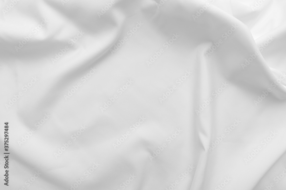 Abstract white fabric texture background. Cloth soft wave. Creases of satin, silk, and cotton.	