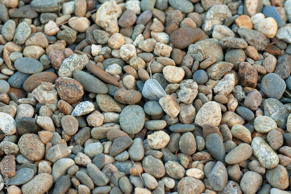 small multi-colored stones. hot summer evening small multi-colored stones. hot summer evening