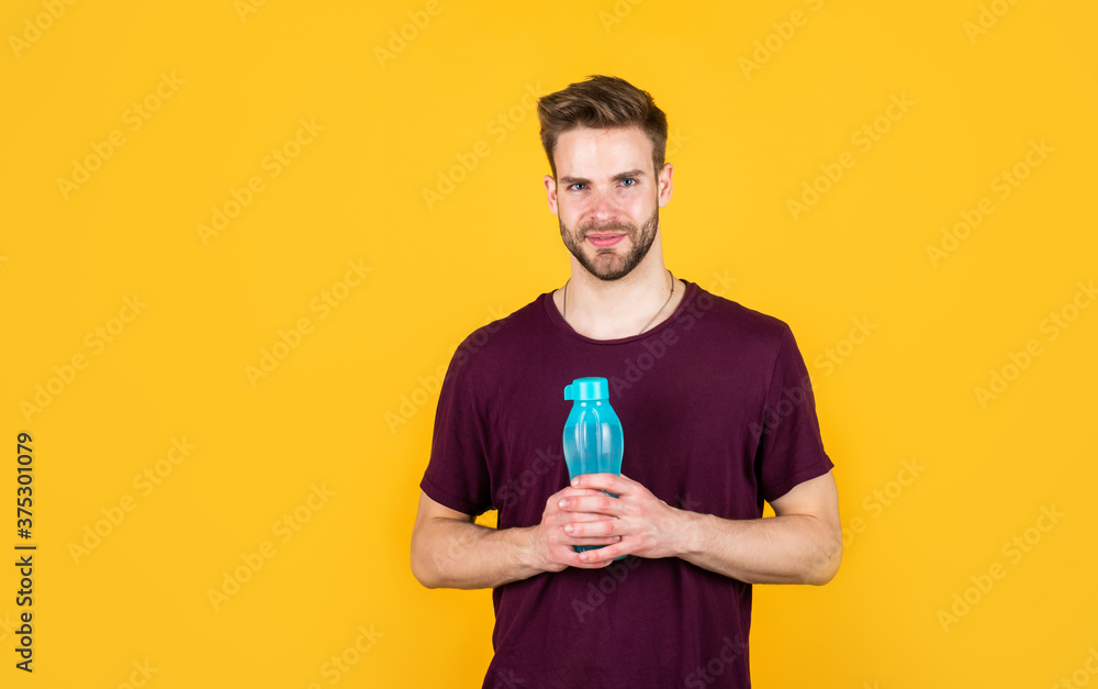 helps metabilize food. Drinking water. Handsome Young Man With Fit Body Drinking Fresh Water. Thirsty fitness male enjoying refreshing drink. concept of drinking water benefits. man drinking water helps metabilize food. Drinking water. Handsome Young Man With Fit Body Drinking Fresh Water. Thirsty fitness male enjoying refreshing drink. concept of drinking water benefits. man drinking water