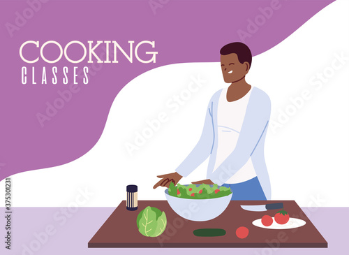 young man cook preparing healthy food in cooking classes
