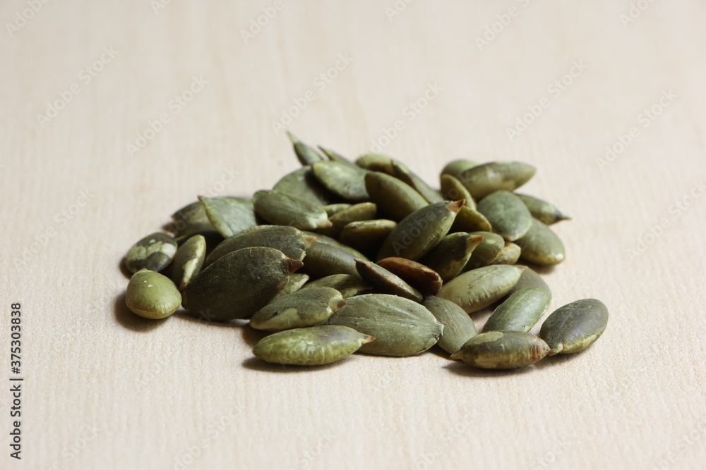Pumpkin Seeds on Wood Background. Pumpkin Seeds on Wood Background.