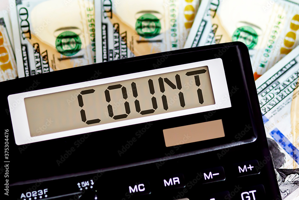 Calculator with text COUNT on the dollars. Business, finance conceptual. Calculator with text COUNT on the dollars. Business, finance conceptual.