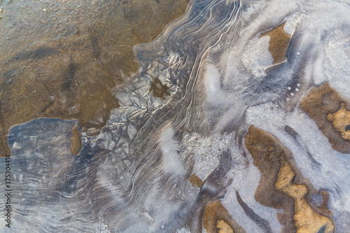 Hoarfrost and fresh powder snow in winter, on a wild, beautiful, river bank photo