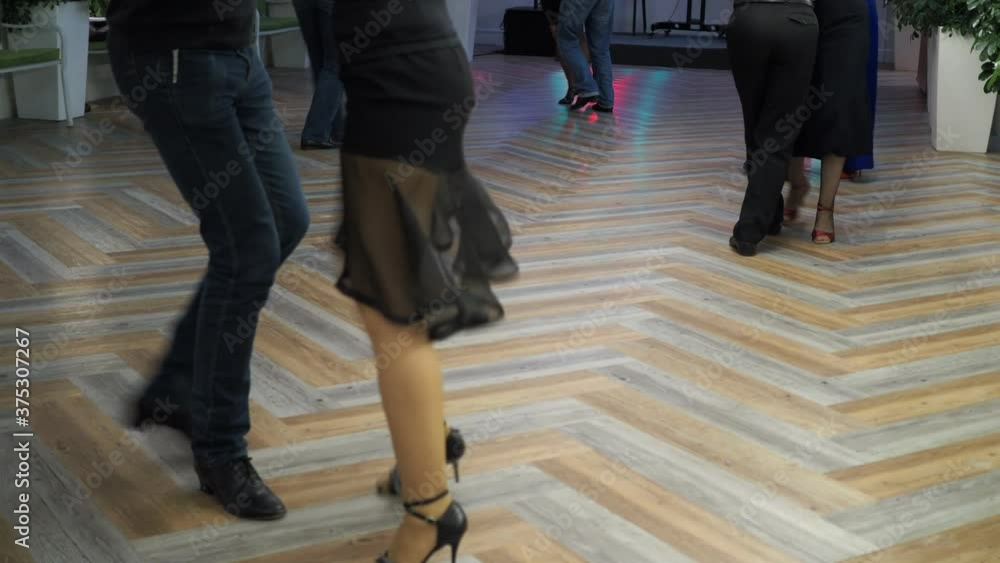 Argentine tango, milonga. Feet of dancers dancing Argentine tango at a party. Bokeh, Novosibirsk. Siberia. Argentine tango, milonga. Feet of dancers dancing Argentine tango at a party. Bokeh, Novosibirsk. Siberia.