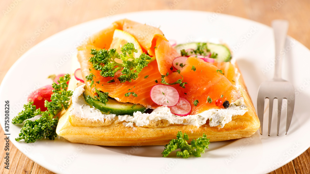 waffle with cream, smoked salmon and cucumber waffle with cream, smoked salmon and cucumber