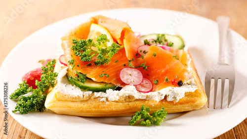 waffle with cream, smoked salmon and cucumber