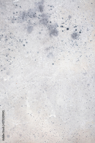 Light blue wall with abstract spots. Beautiful gray, white texture, abstract wall surface background, vintage surface texture with copy space, unusual mottled surface.