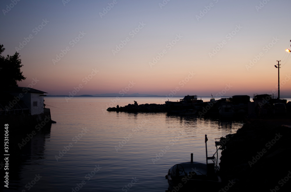 Naklejka premium sunset over the river