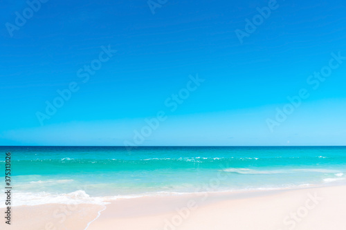 Beautiful tropical beach with blue sky and white clouds abstract texture background. Copy space of summer vacation and holiday business travel concept.