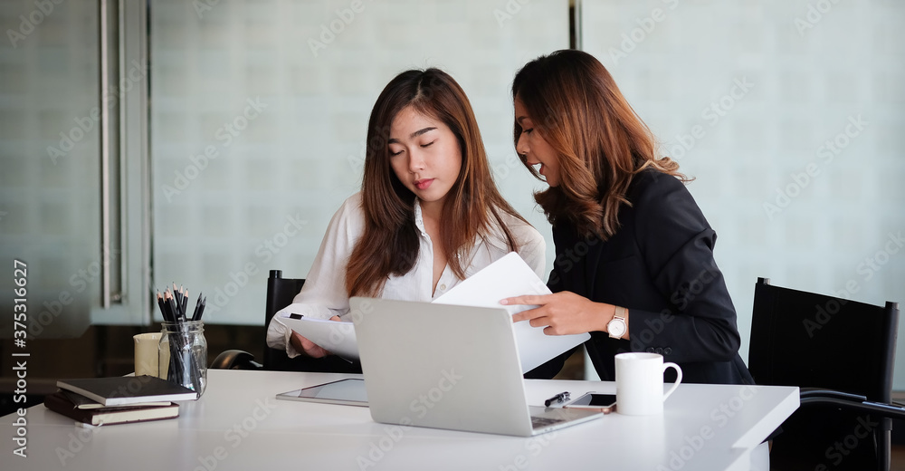 Concept business woman working and people happy businesswoman or creative female office worker with computers writing to notebook with documents and laptop. Concept business woman working and people happy businesswoman or creative female office worker with computers writing to notebook with documents and laptop.