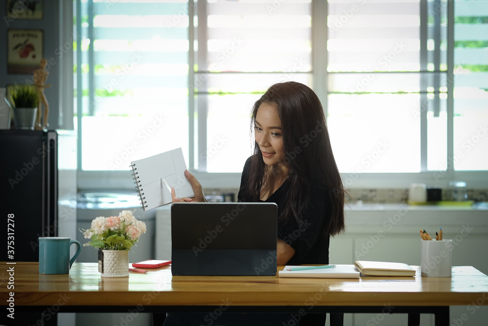 Business women work from home living room enjoying sunny morning on the day with documents and laptop people Consulting and business planning.
Business women work from home living room enjoying sunny morning on the day with documents and laptop people Consulting and business planning.
