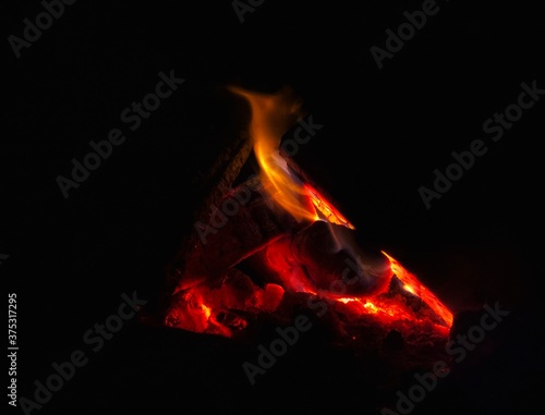 Burning coal in a fire at night