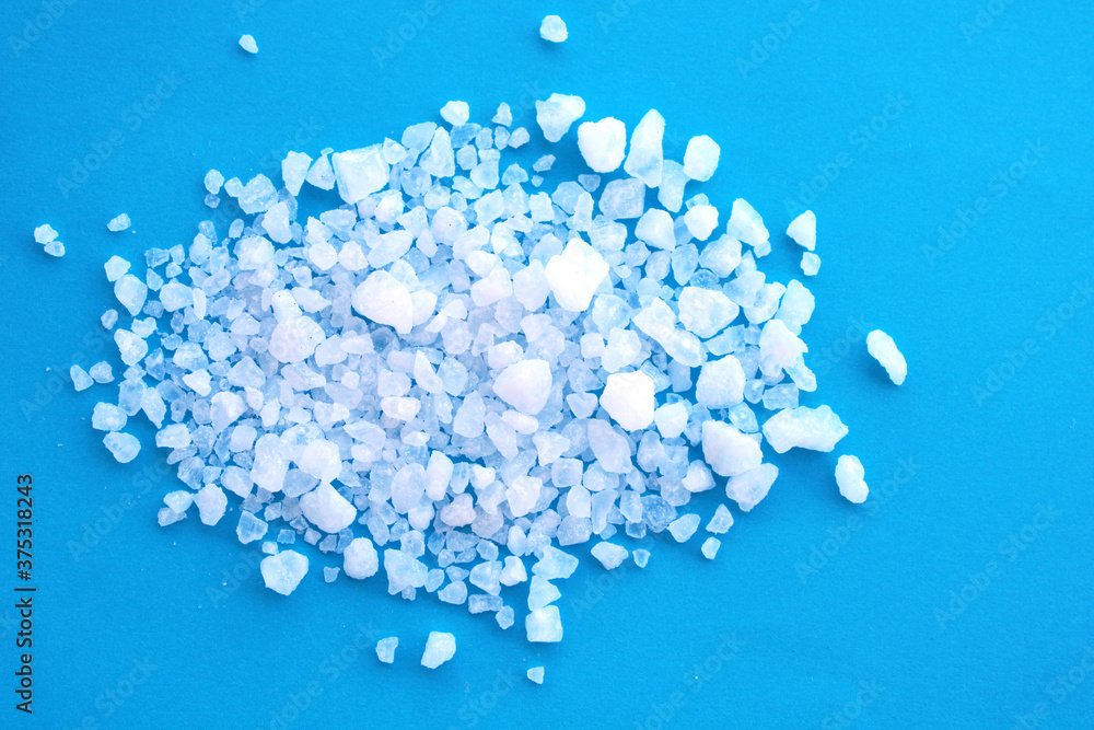 natural sea salt on blue background natural sea salt on blue background
