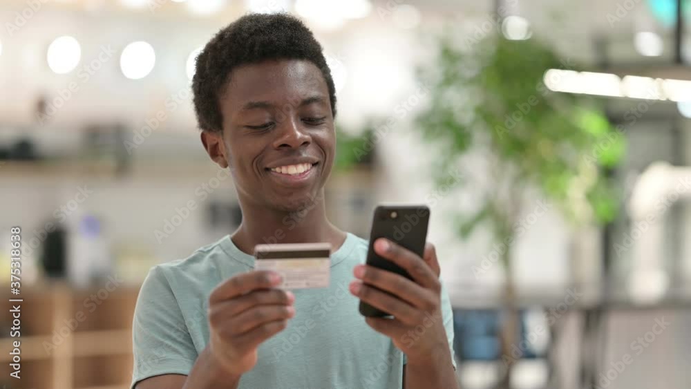 Online Shopping by Young African Man, Online Payment on Smartphone Online Shopping by Young African Man, Online Payment on Smartphone