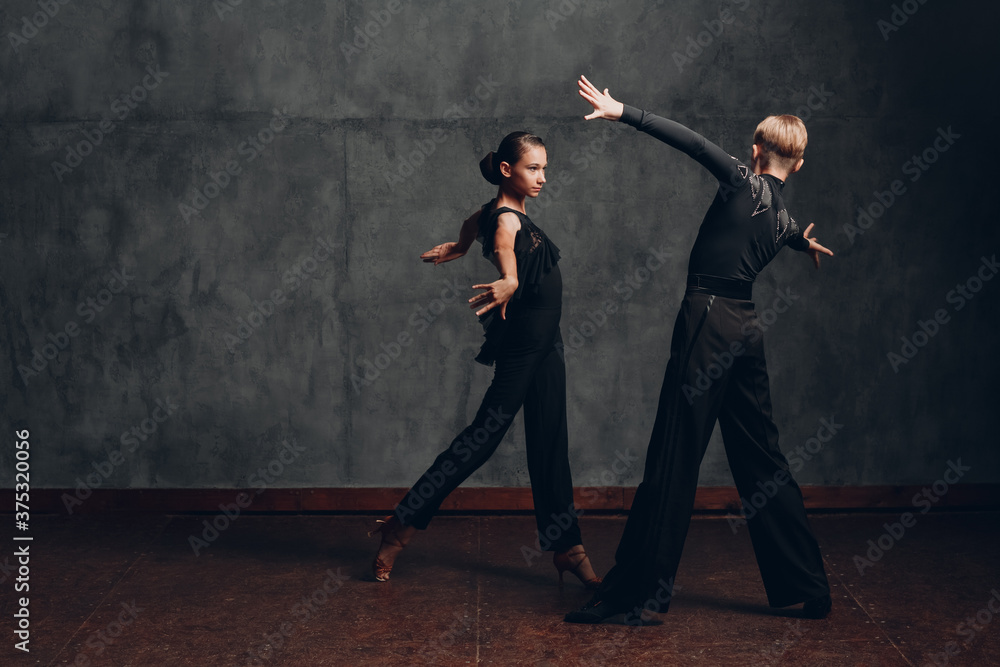 Young couple dancing in ballroom dance Paso doble