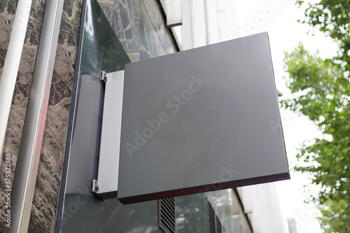 Blank sign board on a shop wall