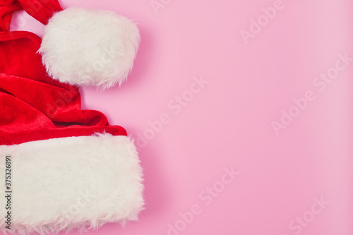 christmas hat on a pink background isolate, copy space, layout