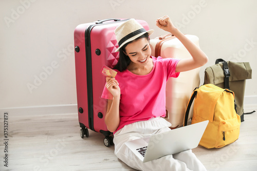Woman with laptop booking t...