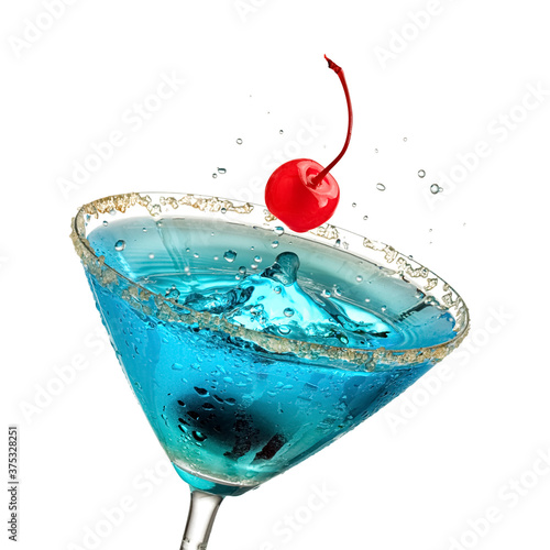Red cherry up from a blue martini cocktail