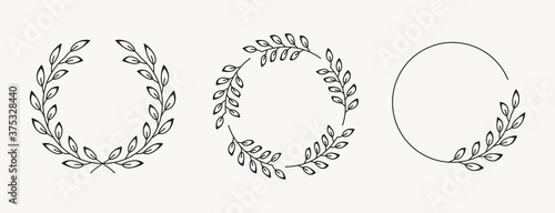 Set of laurel wreath design elements. Black circle border vector ornaments.