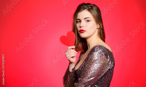 Romantic greeting. Be my valentine. Love and romance. Valentines day sales. Valentines day party. I love you. Sexy woman in glamour dress. Sensual girl with decorative heart. Endless love. copy space.