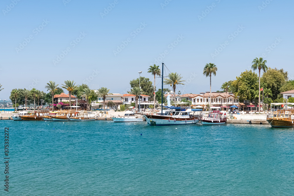 Port with sightseeing boats, beautiful scenery, Resort town Side in Turkey