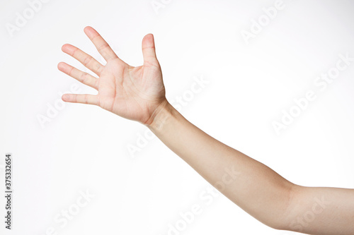 a woman's hand with her fingers stretched out.