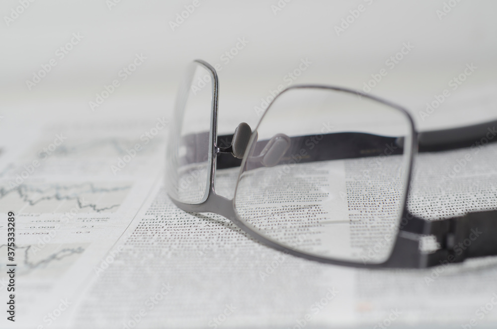 Financial Newspaper and Eyeglasses. Financial Newspaper and Eyeglasses.