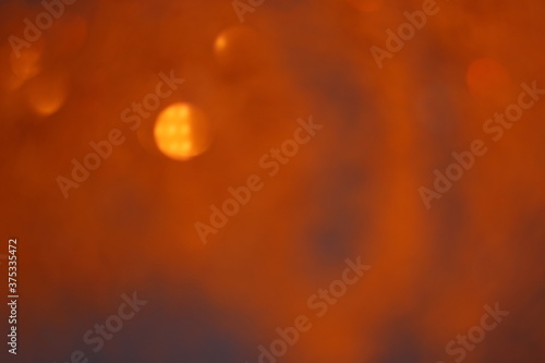 Bokeh orange slightly brown abstract background