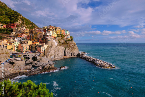Colorful traditional houses on the rock over Mediterranean sea  Manarola  Cinque Terre  Italy