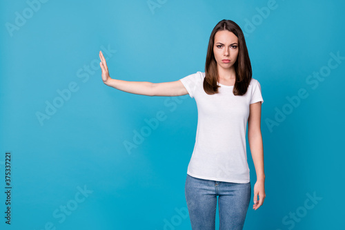 Stop dont move. Photo of serious girl hold hand block way copyspace wear good look clothes isolated over blue color background