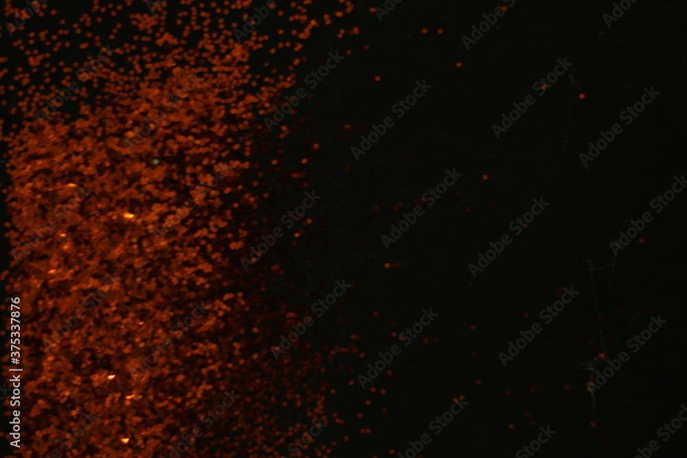 Fototapeta Streszczenie ciemnopomarańczowe kropki czarne tło dla tekstury