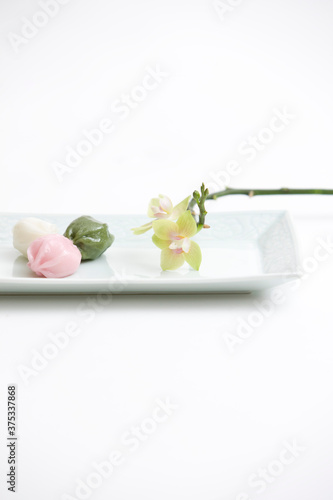 korean traditional honey rice cake with flower on plate