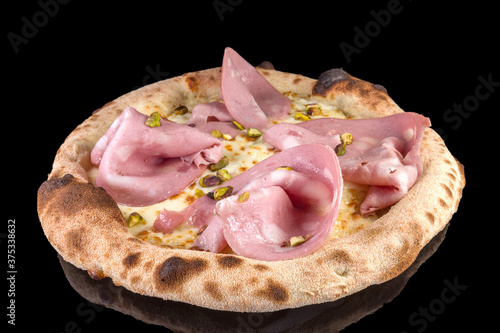 Delicious pizza with mortadella, pistachio, mushrooms, basil, and tomato sauce with reflection,