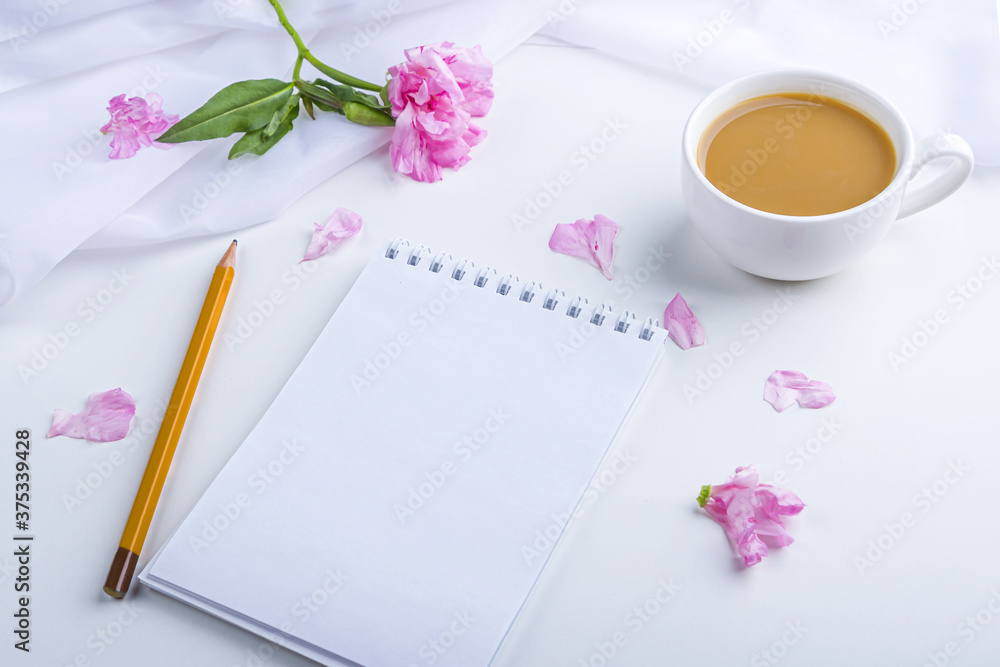 Flat lay flowers romantic still life. Morning coffee mug for breakfast, empty notebook with copy space for text or challenge today and pink flowers. Freelancer woman workplace Flat lay flowers romantic still life. Morning coffee mug for breakfast, empty notebook with copy space for text or challenge today and pink flowers. Freelancer woman workplace