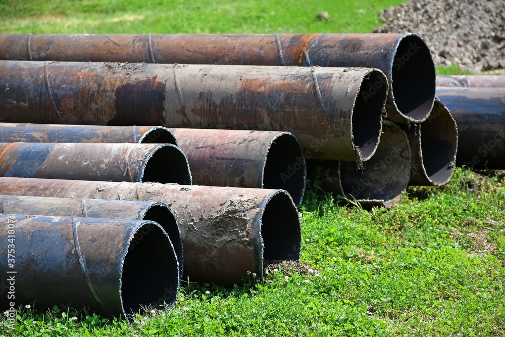 Large metal pipes at the construction site Large metal pipes at the construction site