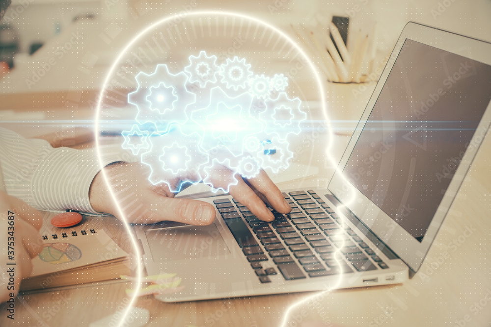Man typing on keyboard background with brain hologram. Concept of big Data. Double exposure. Man typing on keyboard background with brain hologram. Concept of big Data. Double exposure.