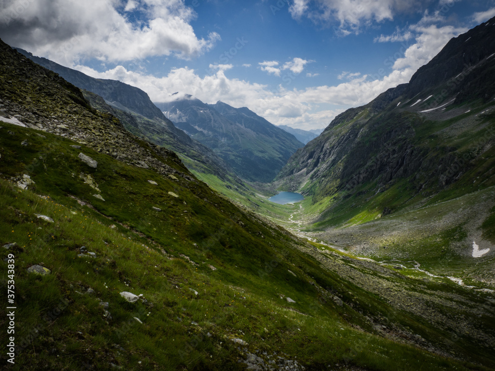 Scenic view to the Alpine valley on the way across Kalser Tauern near small and nice city Kals, Austria, Europe. National park Hohe Tauern. Favourite destination for family holidays in heart of Alps.