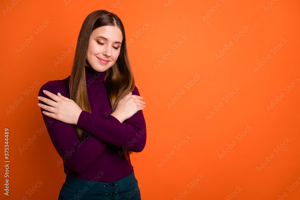 Obraz premium Photo of cheerful satisfied girl love herself hug cuddle close eyes wear purple jumper isolated over shine color background