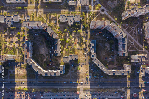 Top view architectural background texture, style, concept, creative aerial view. Kiev (Kyiv) Ukraine outskirt Troieshchyna three identical panel houses. Horizontal composition. Drone photo