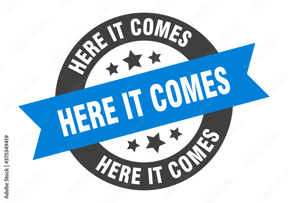 Fototapeta premium here it comes sign. round ribbon sticker. isolated tag