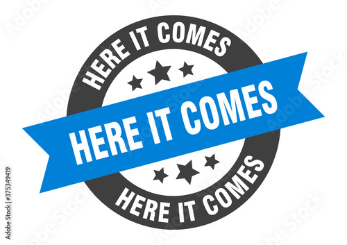 here it comes sign. round ribbon sticker. isolated tag