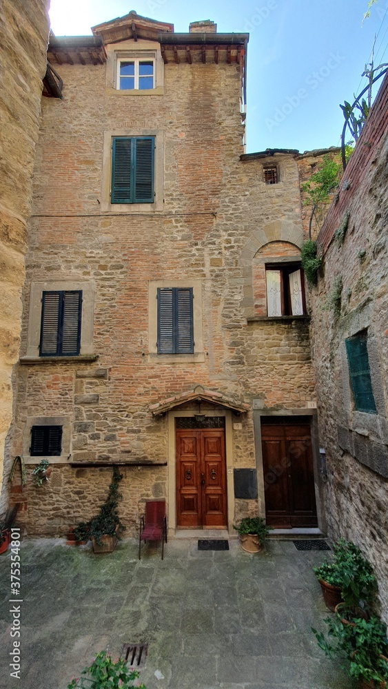 Ancient buildings in the city centre of the beautiful Cortona, Italy.