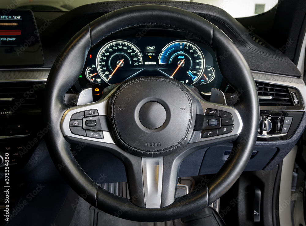 Interior view of car with steering wheel 