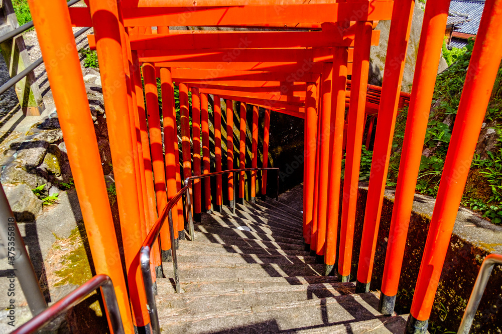 Japanese red torii in autumn near usuki Japanese red torii in autumn near usuki