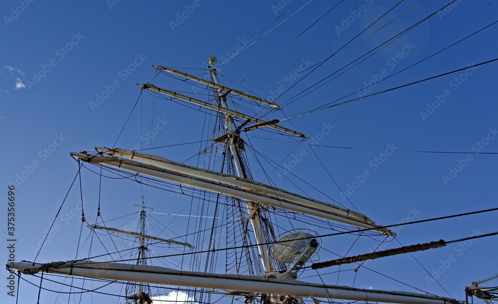 Rigging of a large wooden tall ship, mast and booms.
