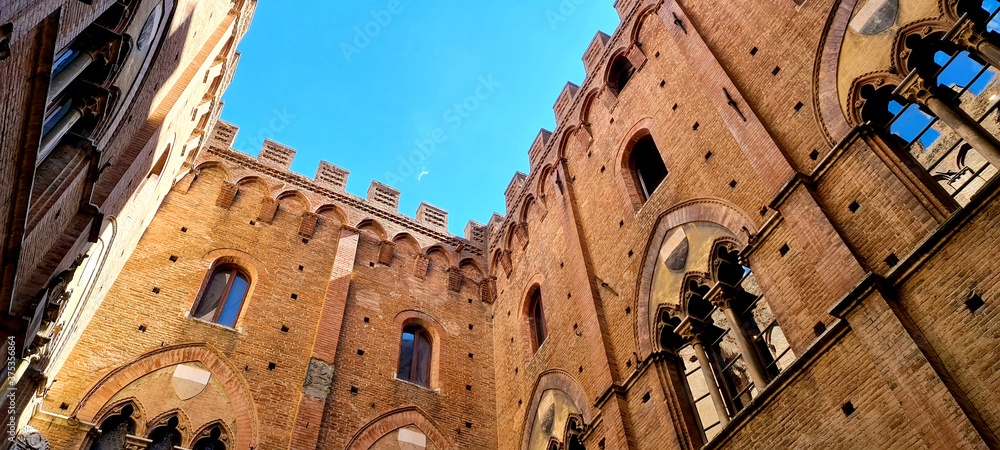 bottom view in a characteristic castle of Siena in Italy
