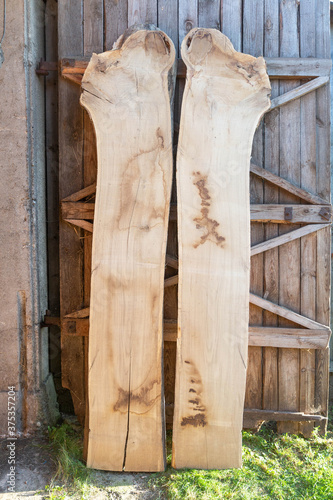 Cut wooden boards at woodworker workshop