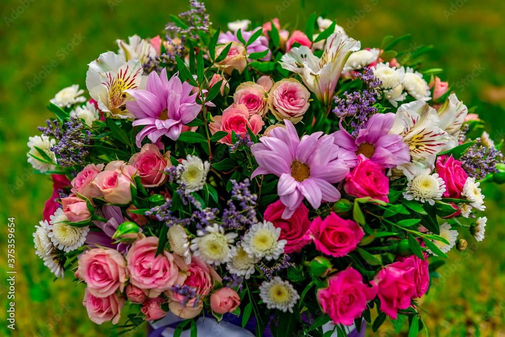a bouquet of flowers stands in the Park on a Sunny summer day